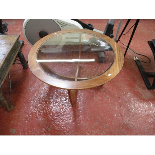 224 - A mid century G plan circular coffee table with glass top