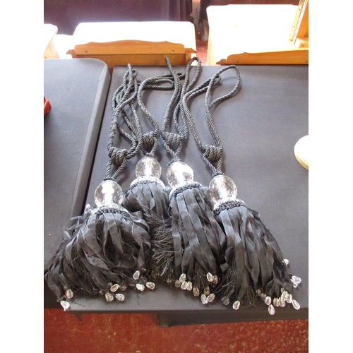 229 - Four black tassel tie backs with crystal ornamentation