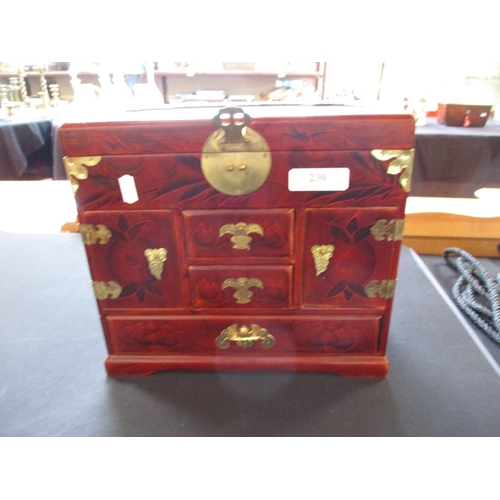 230 - An oriental jewellery box together with a small quantity of costume jewellery