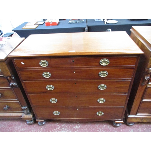 263 - A chest of four drawers fitted brass handles and escutcheons