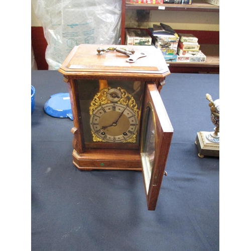 294 - An oak cased mantle clock