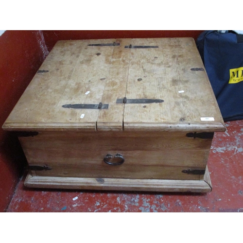 305 - A large pine coffee table modelled as a chest