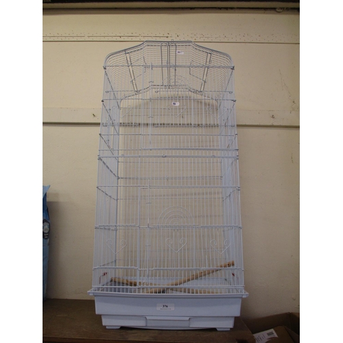 376 - A white metallic bird cage with heart design decoration