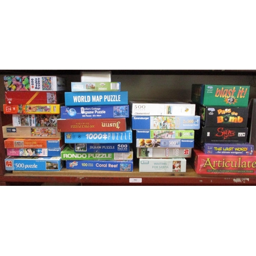 382 - A quantity of jigsaw puzzles, games etc.