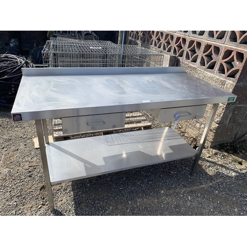 19 - A stainless steel preparation table fitted two drawers and an under tier