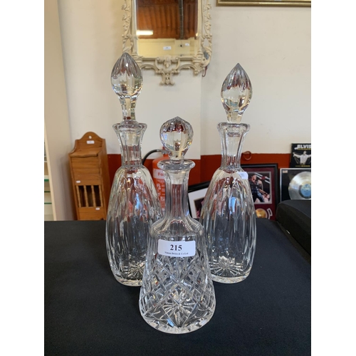 215 - Three glass decanters