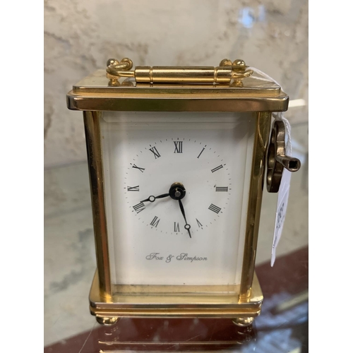 333 - A brass cased carriage clock by Fox & Simpson with key