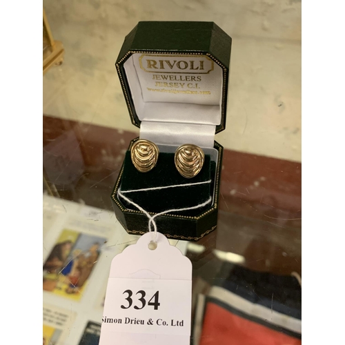 334 - A pair of 9 carat gold clip on earrings