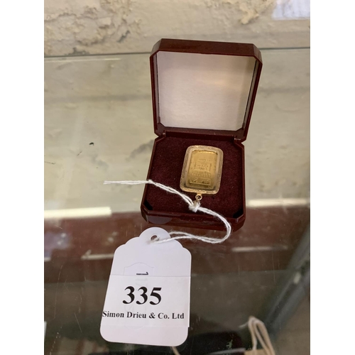 335 - A JM Assayers 24 carat gold 5gm ingot in 9 carat gold surround