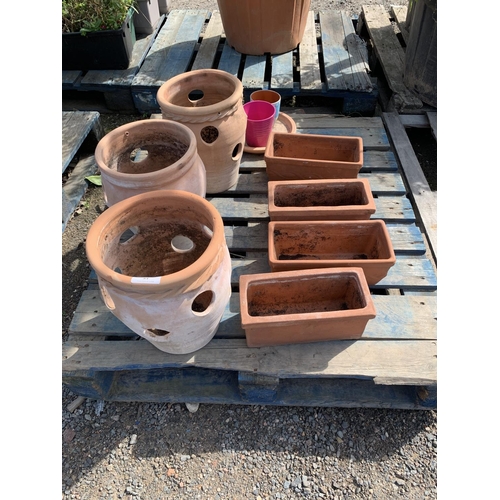 84 - Three terracotta strawberry pots together with four terracotta planters etc.