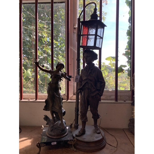 129 - A spelter figural table lamp modelled in the form of a young boy beneath a street lamp together with... 