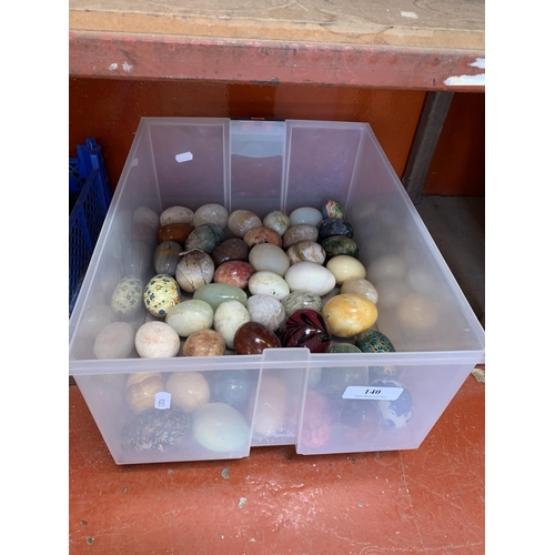 140 - A varied assortment of onyx and other stone eggs