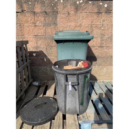 44 - A green PVC wheelie bin together with a black PVC dustbin and a quantity of kindling wood