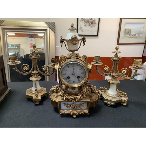 311 - A vintage gilded mantle clock and garniture