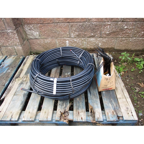 59 - Two coils of irrigation pipe