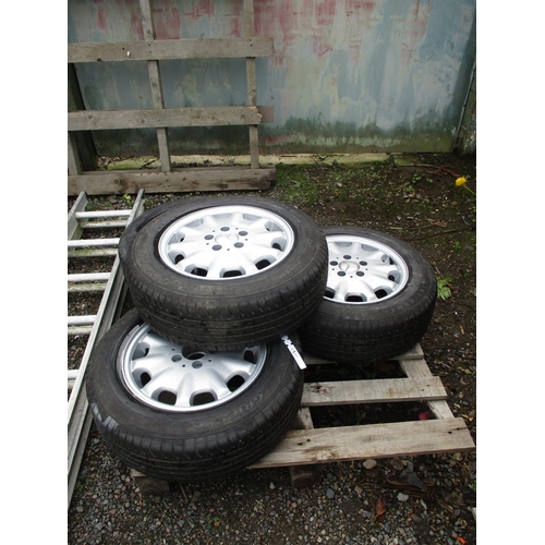 62 - A set of four Mercedes alloy wheels and tyres (195/65R15)