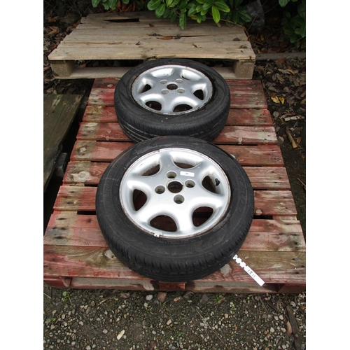 66 - A pair of alloy wheels and tyres (185/60R14)