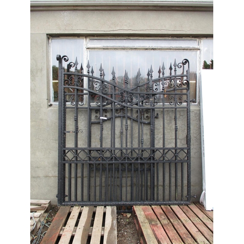 71 - A pair of substantial wrought iron entrance gates (4m approx span) together with a matching personne... 