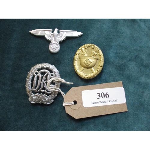 306 - A German World War II gold wound band an Eagle and a DRL badge