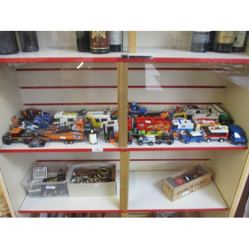 313 - A large and varied assortment of Lego vehicles and figures