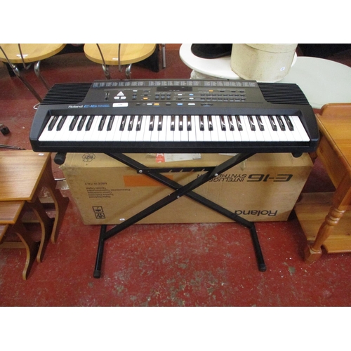 324 - A Roland E-16 Intelligent synthesiser and stand