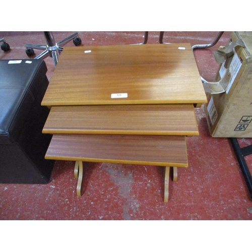 325 - A graduated nest of three mid century occasional tables