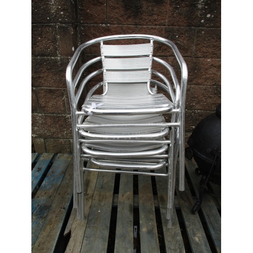 52 - Four aluminium stacking bistro chairs