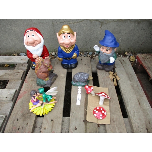 67 - A collection of garden gnomes and other garden models