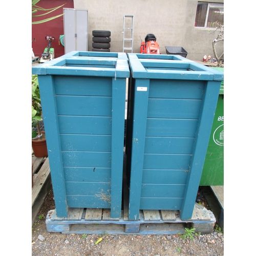 96 - A set of four tall square wooden planters finished in blue