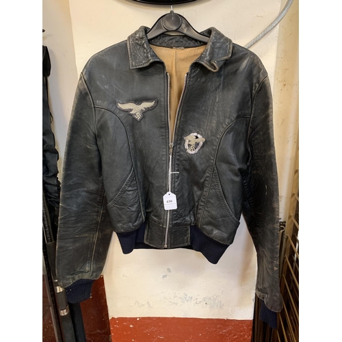 430 - A vintage leather bomber jacket with World War II German insignia