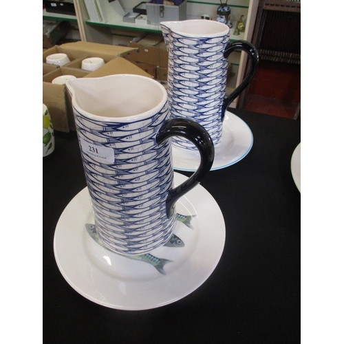 231 - Two Jersey Pottery pitchers decorated with Mackerel together with two plates decorated with Mackerel