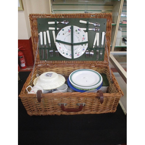 233 - A wicker picnic hamper and contents