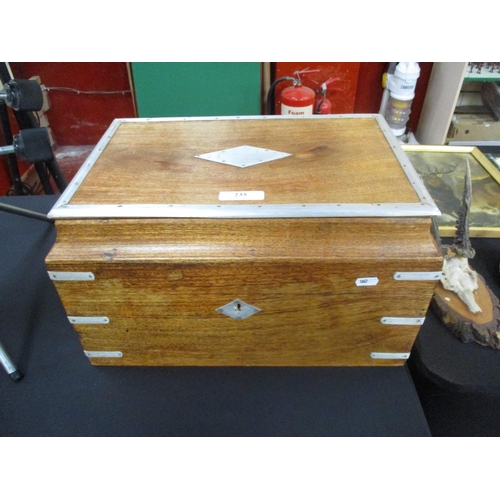 235 - A large oak box with metal bindings