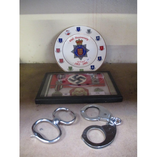 356 - A States of Jersey Police commemorative plate, two pairs of handcuffs etc.