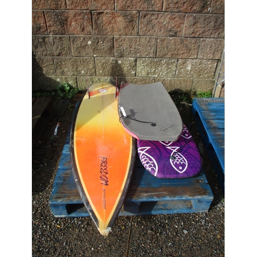 40 - Two boogie boards together with a surf board