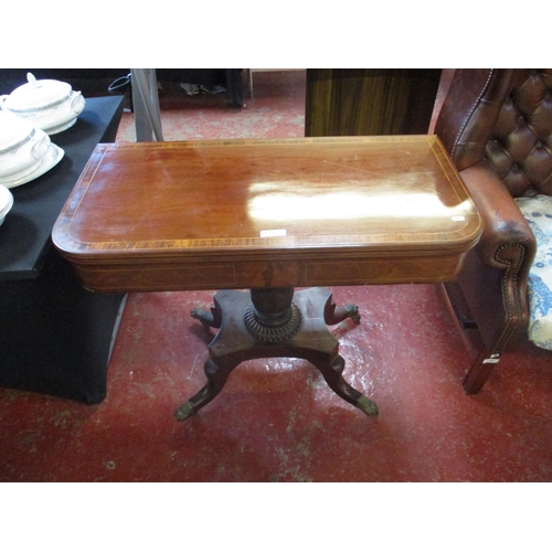 243 - A mahogany folding table with marquetry inlaid top