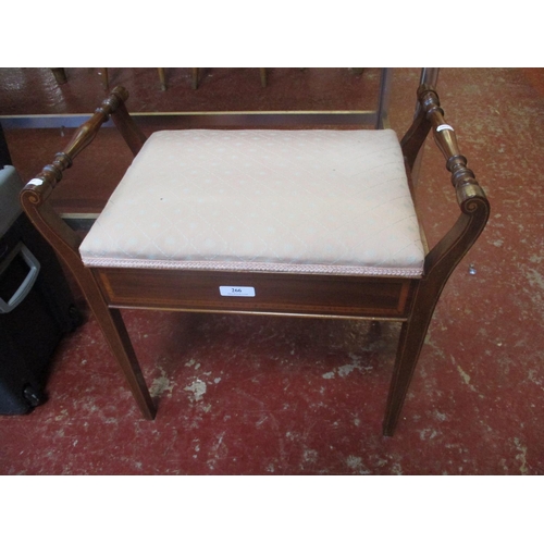 266 - A piano with upholstered lidded seat