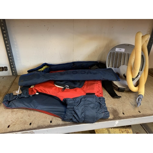 128 - Two life jackets together with an inflatable dinghy foot pump