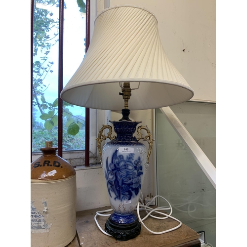 143 - A Victorian blue, white and gilded vase now converted to electricity