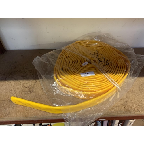 145 - A coil of lay flat hose