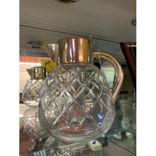 161 - A glass punch/pimms jug with silver plated mounts