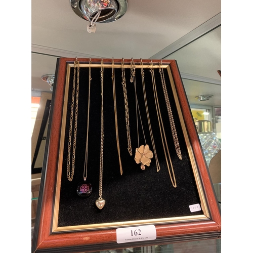 162 - A collection of 9 carat gold plated chains and pendants