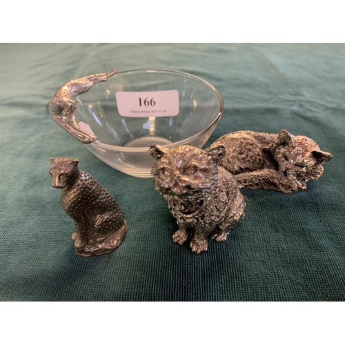166 - A glass dish with reclined cheetah together with a silvered cheetah model and two silver plated cats