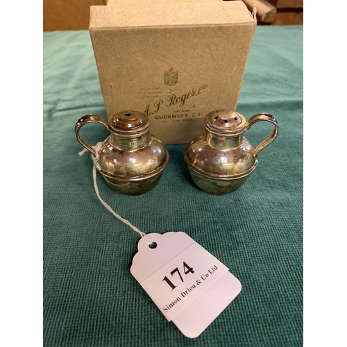 174 - A pair of silver salt and pepper casters modelled in the form of milk cans