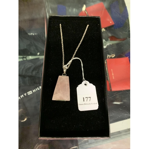 177 - A pink quartz pendant in silver mount and suspended from a silver chain