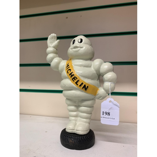 198 - A cast iron money box modelled in the form of the Michelin Man