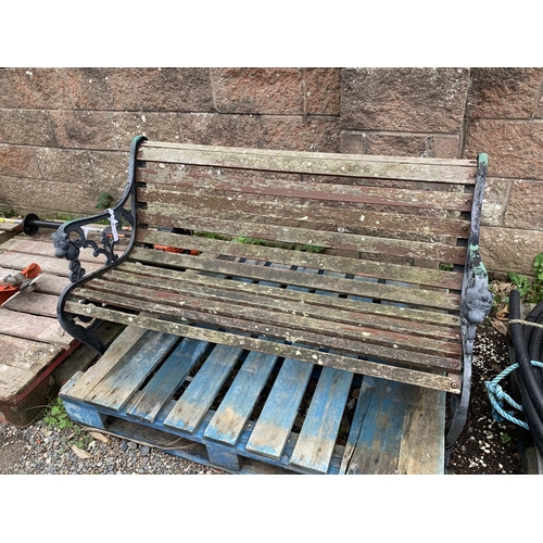 58 - A metallic framed and wooden garden bench
