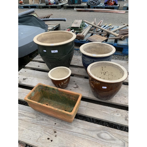 66 - Four salt glazed stone ware planters together with a terracotta planter
