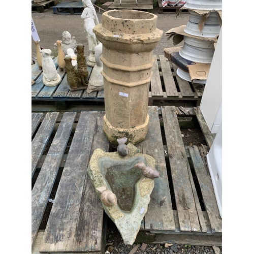 77 - A reconstituted stone bird bath together with a vintage chimney pot