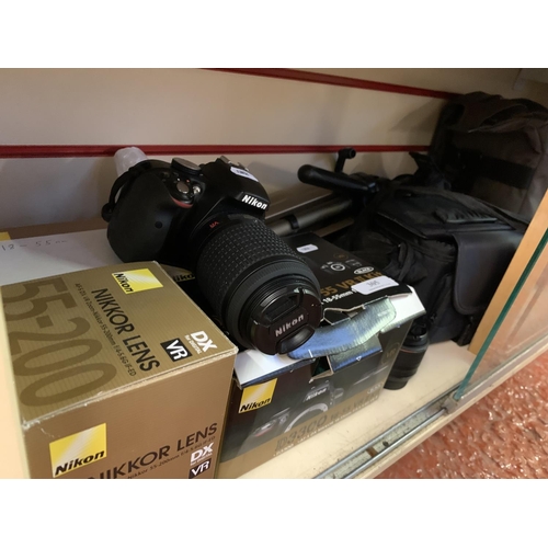 305 - A varied accumulation of photographic equipment and luggage